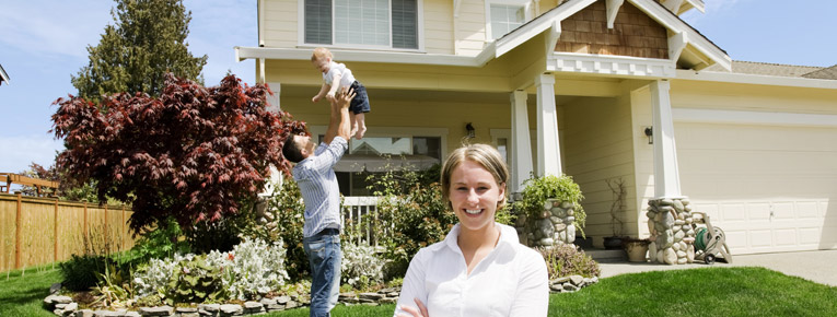 happy family near their new house