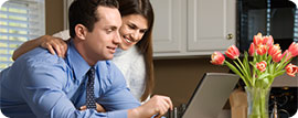 couple in a front of computer