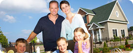 happy family with kids in front of house